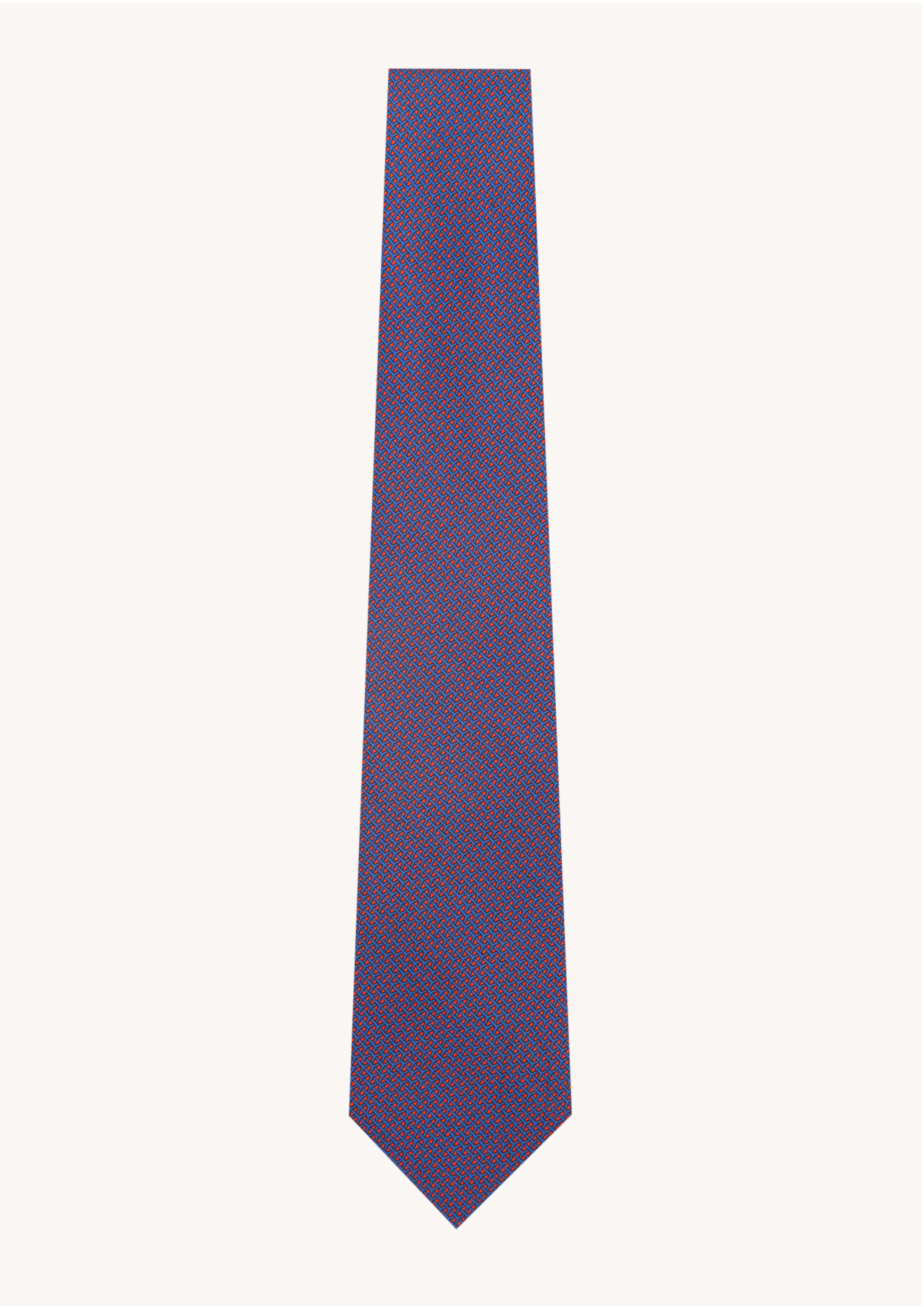 Cravate en twill 100% soie, ornée d'un motif géométrique bleu sur fond rouge