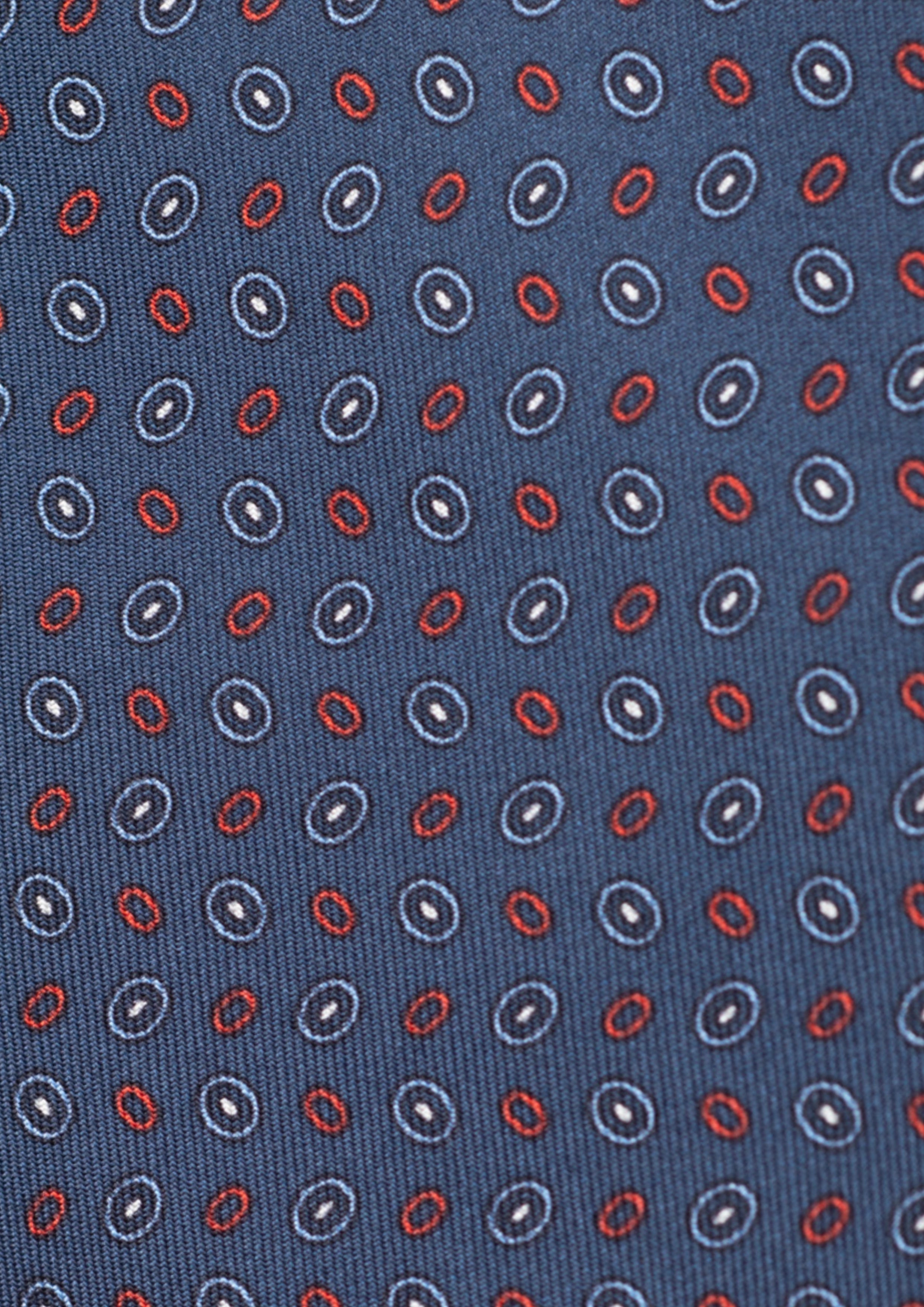 Cravate en twill 100% soie, ornée d'un motif ovale rouge et blanc sur fond bleu