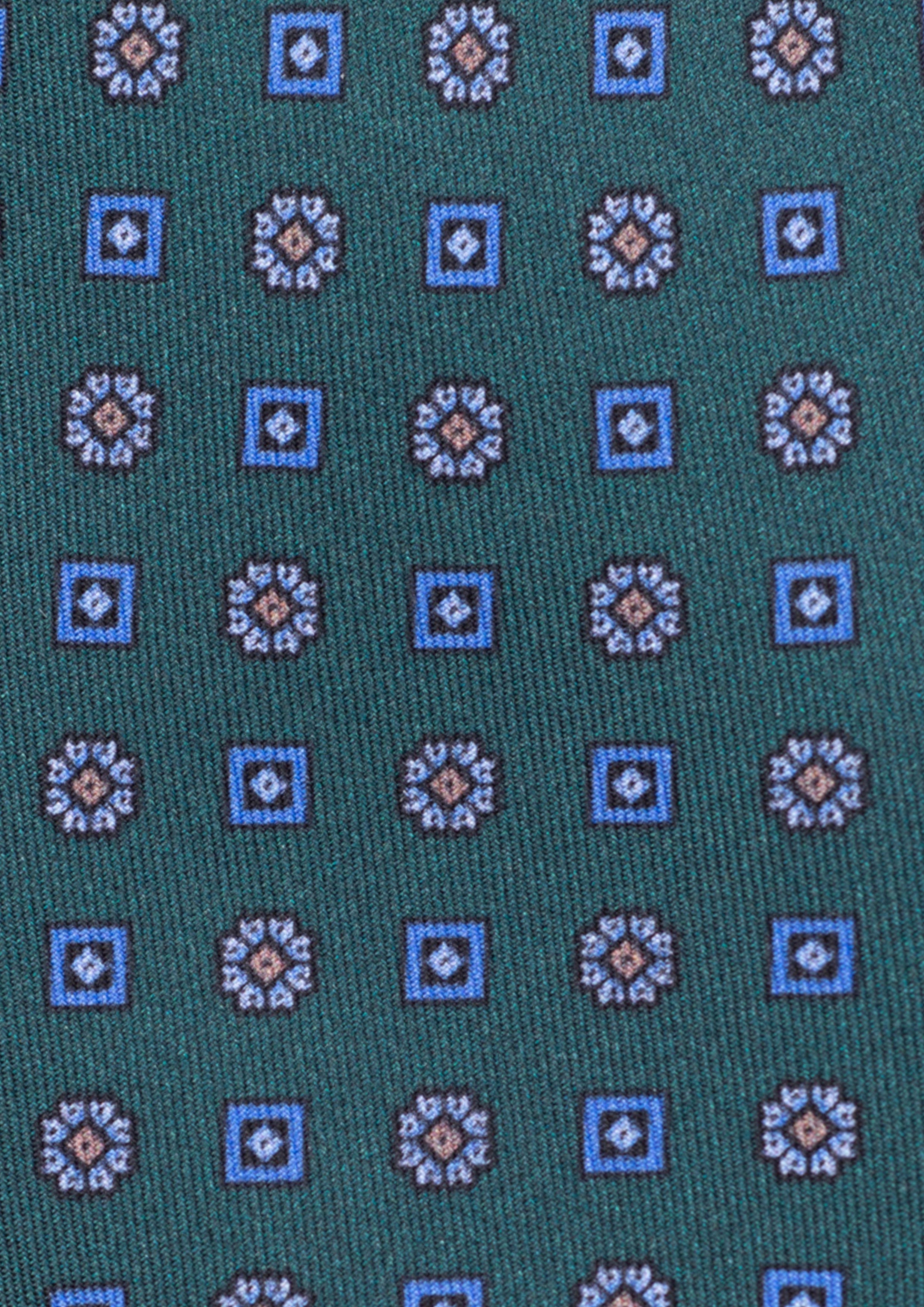 Cravate en twill 100% soie, ornée d'un motif de fleurs bleues sur fond vert