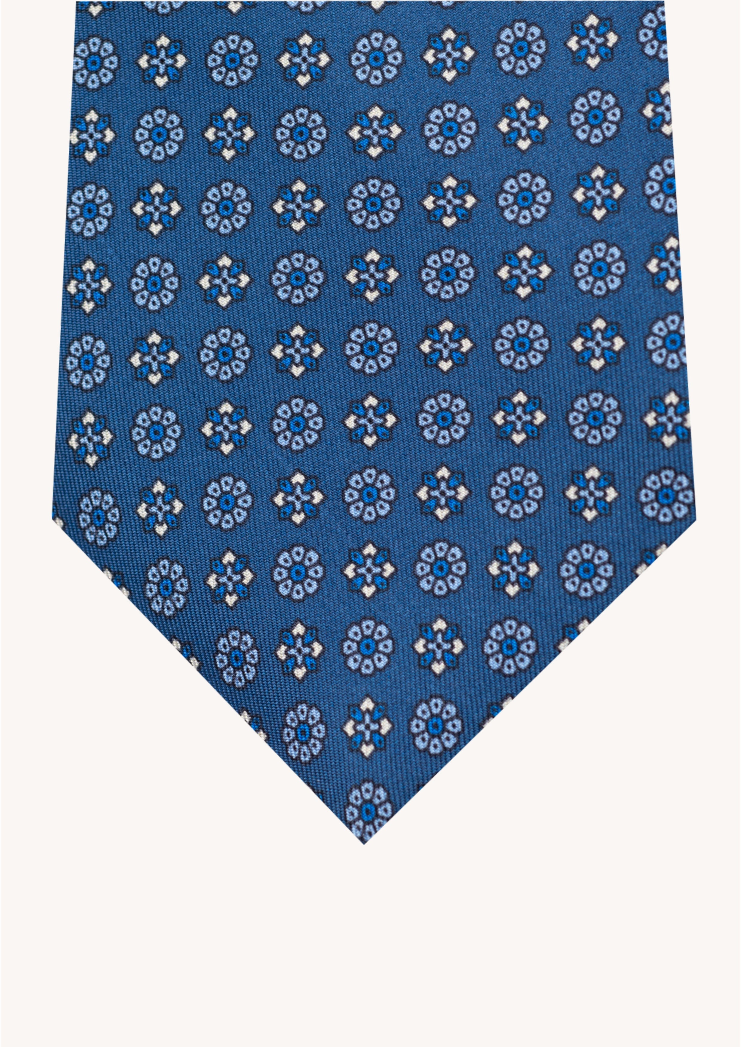 Cravate en twill 100% soie, ornée d'un motif de fleurs bleues et blanches sur fond bleu
