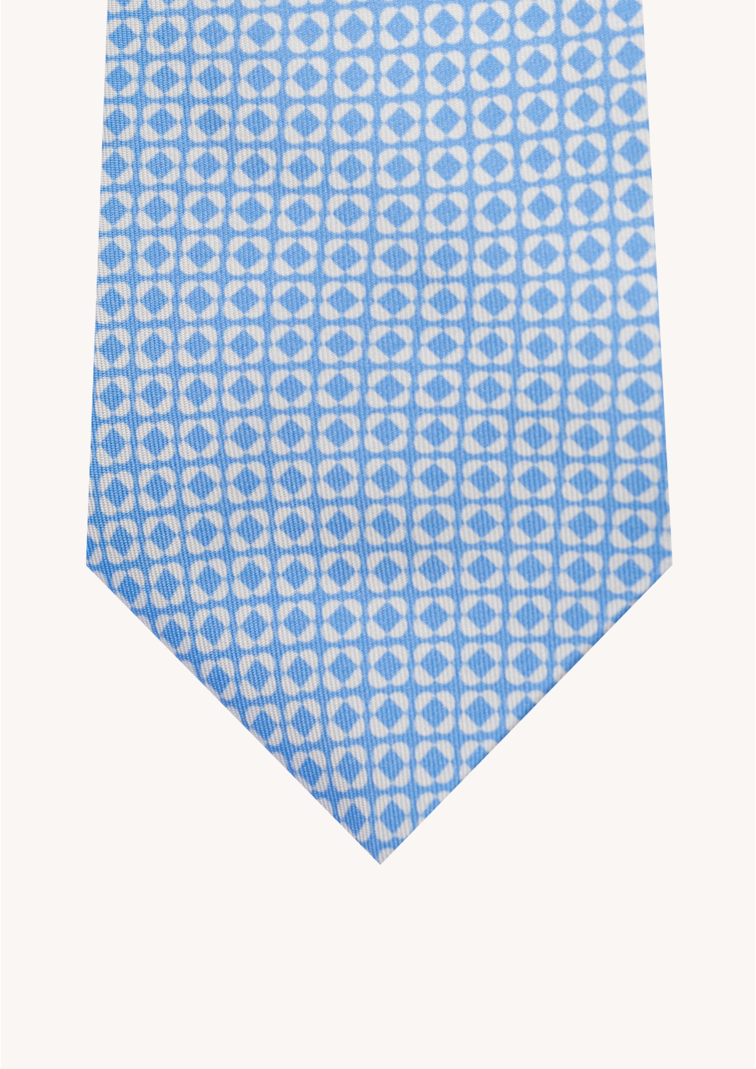 Cravate en twill 100% soie, ornée d'un motif de fleurs blanches sur fond bleu