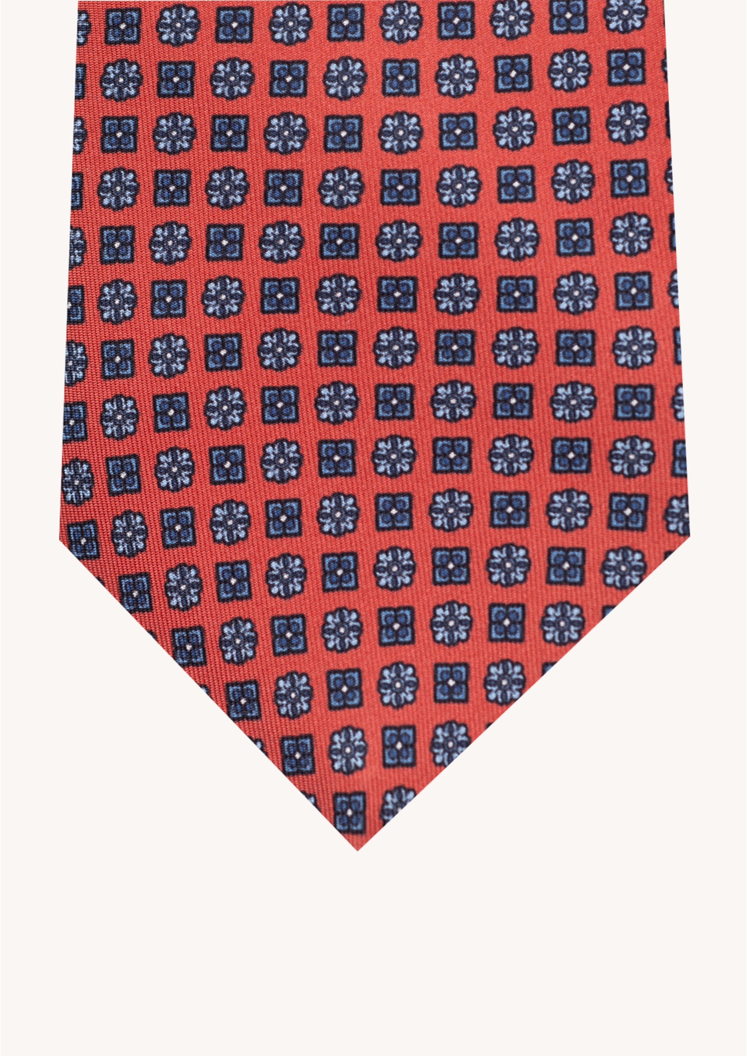 Cravate en twill 100% soie, ornée d'un motif de fleurs bleues sur fond rouge