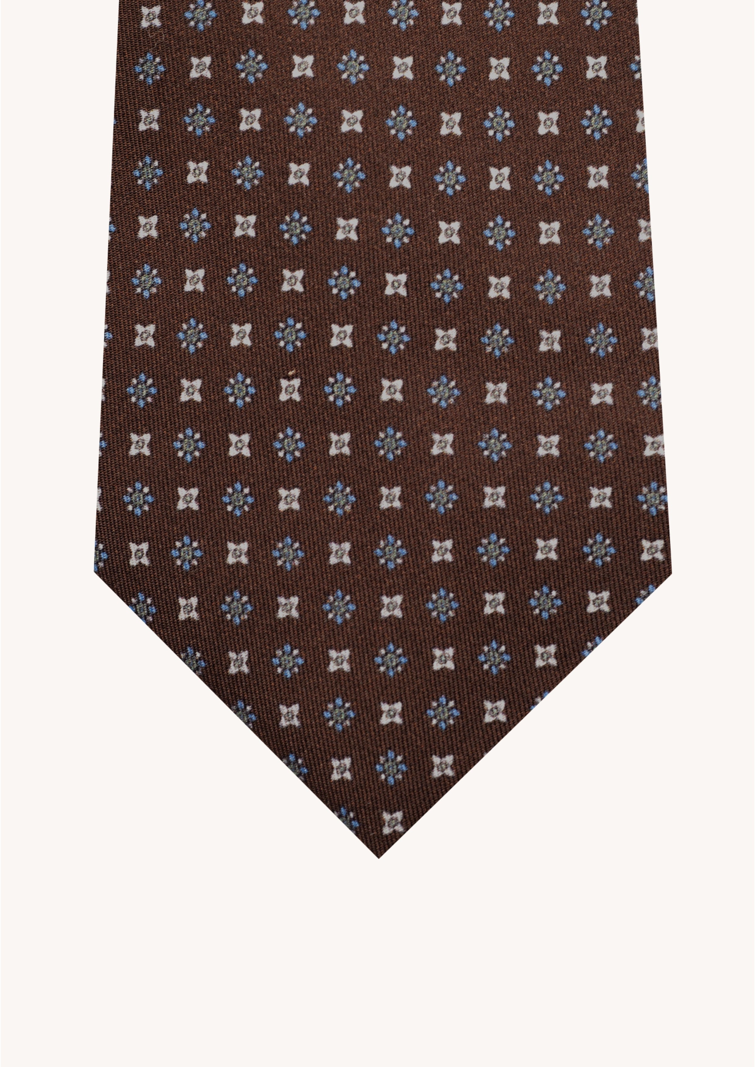 Cravate en twill 100% soie, ornée d'un motif de fleurs bleues et blanches sur fond marron