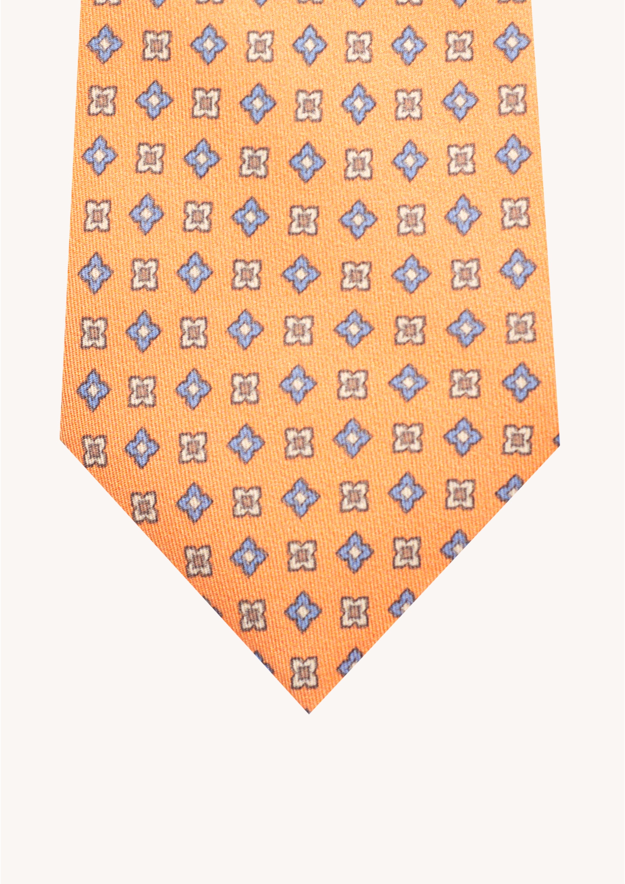 Cravate en twill 100% soie, ornée d'un motif de fleurs bleues et blanches sur fond orange