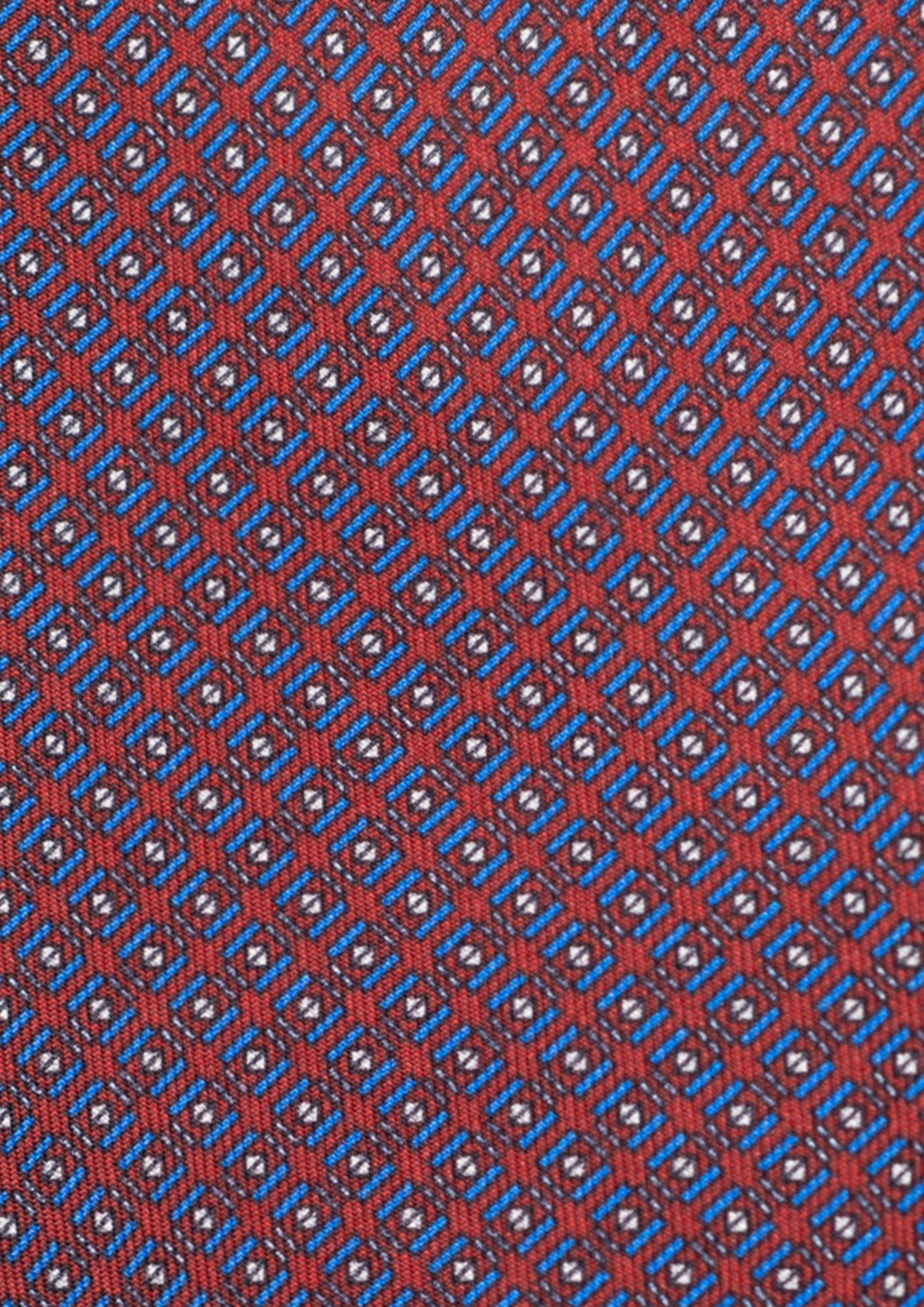 Cravate en twill 100% soie, ornée d'un motif géométrique bleu et blanc sur fond rouge
