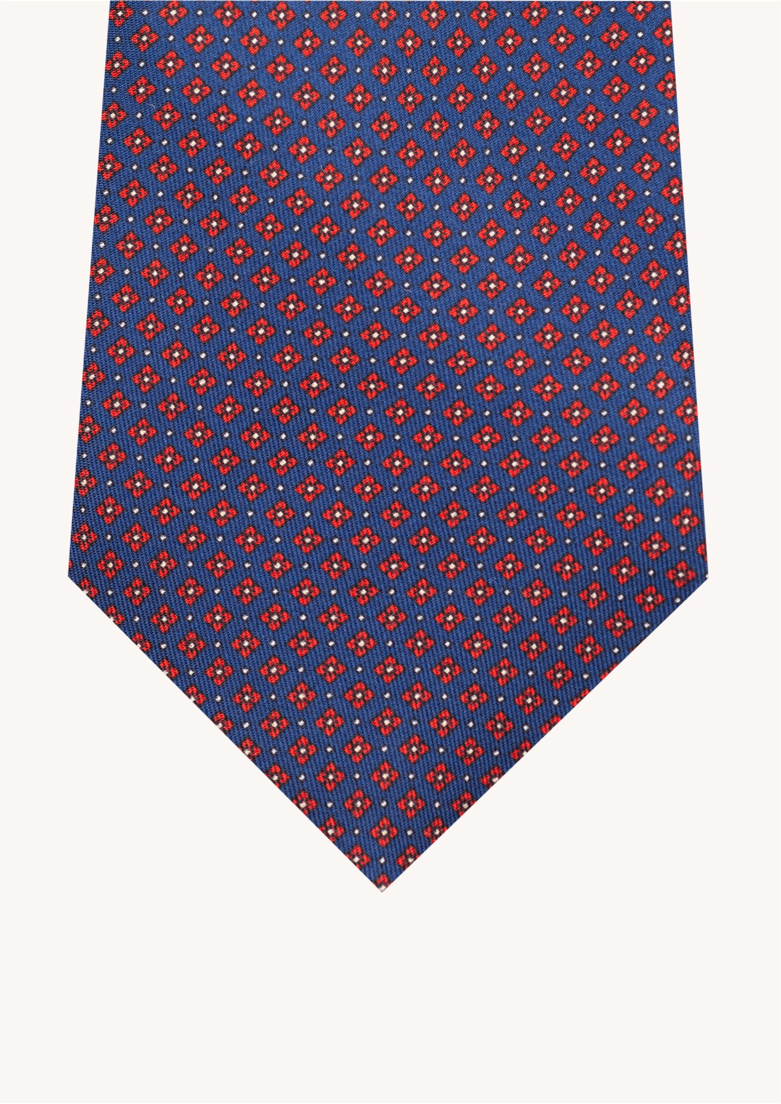 Cravate en twill 100% soie, ornée d'un motif de fleurs rouges sur fond bleu