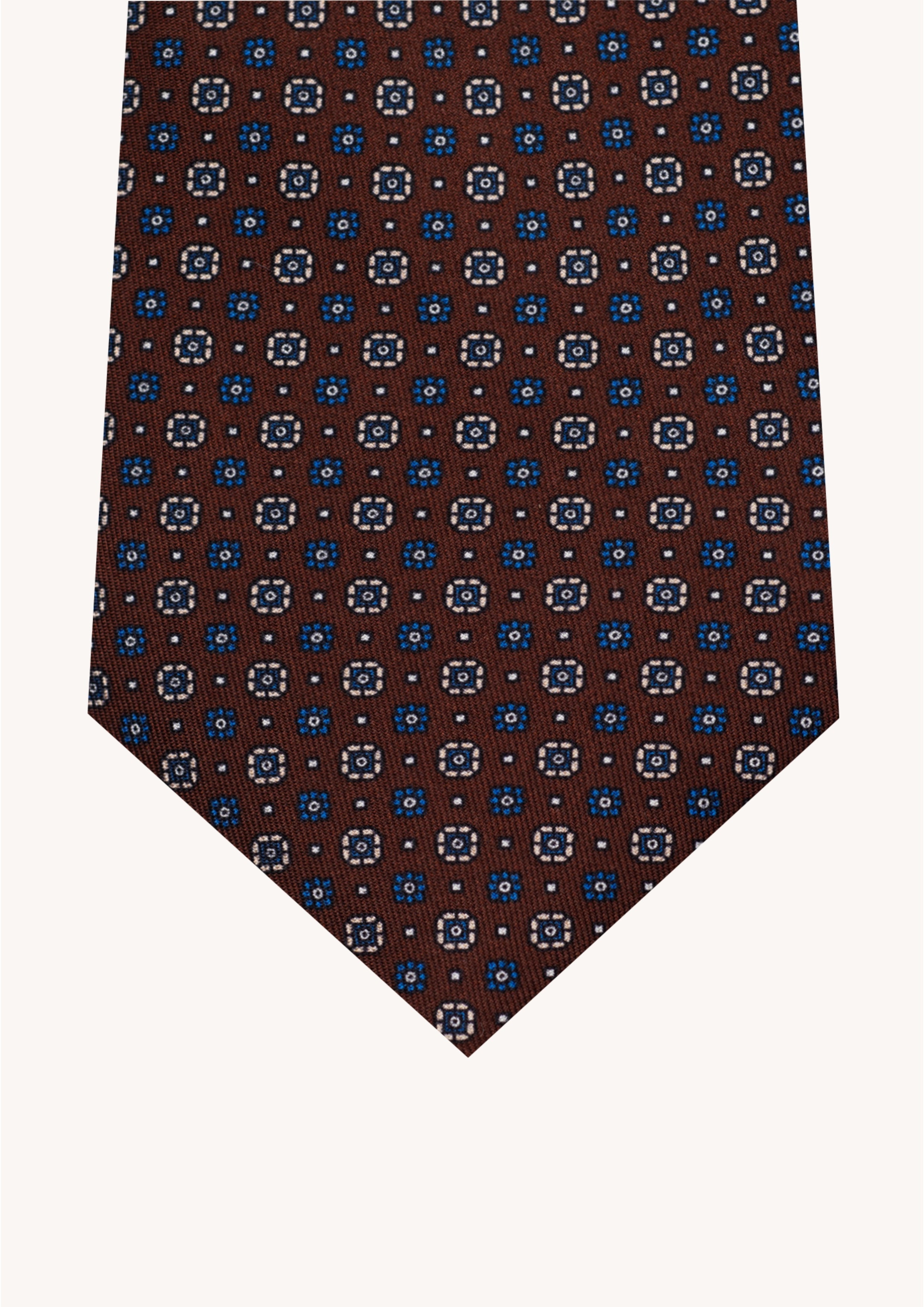 Cravate en twill 100% soie, ornée d'un motif de fleurs bleues et blanches sur fond marron