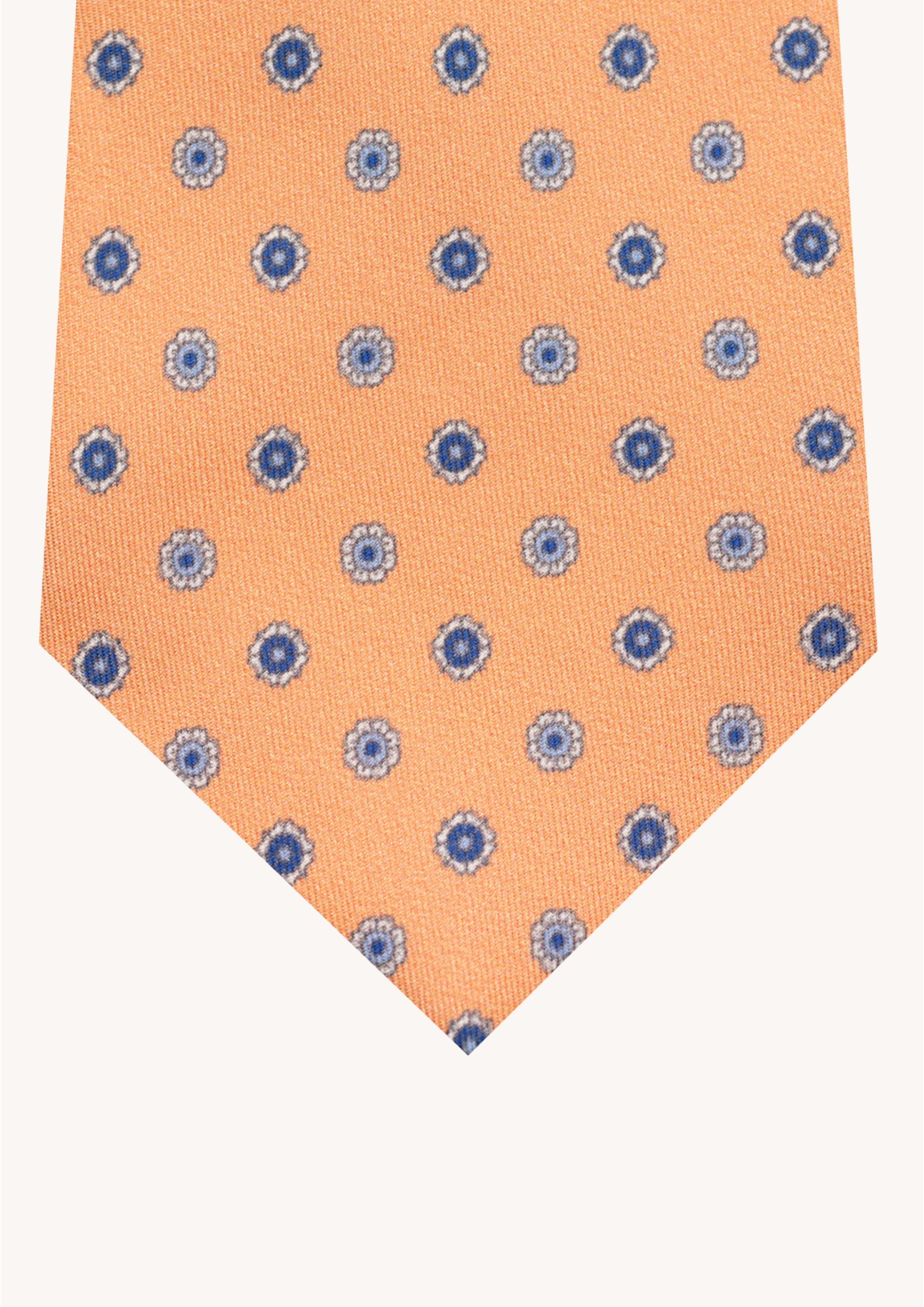 Cravate en twill 100% soie, ornée d'un motif de fleurs bleues sur fond orange
