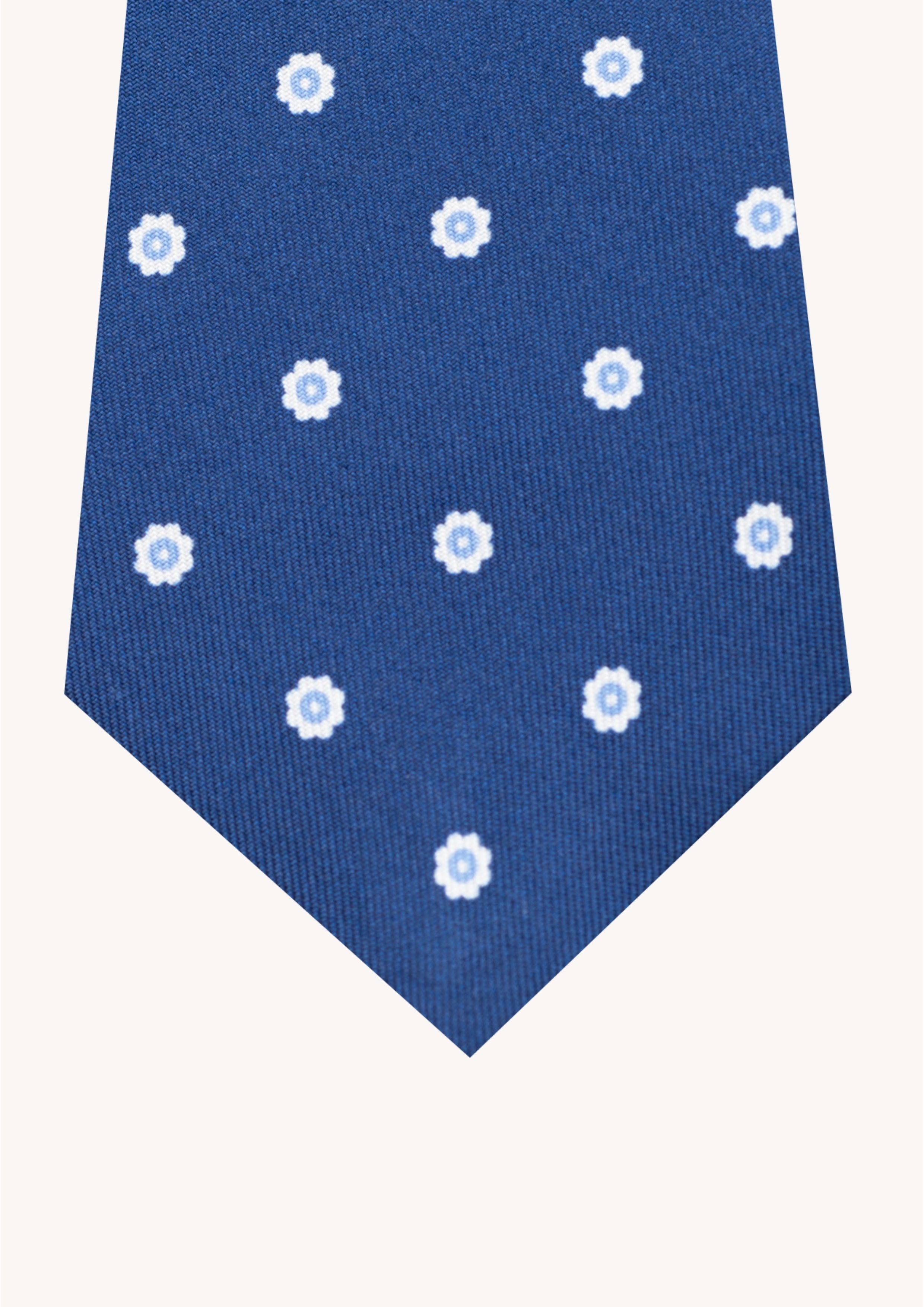 Cravate en twill 100% soie, ornée d'un motif de fleurs blanches sur fond bleu