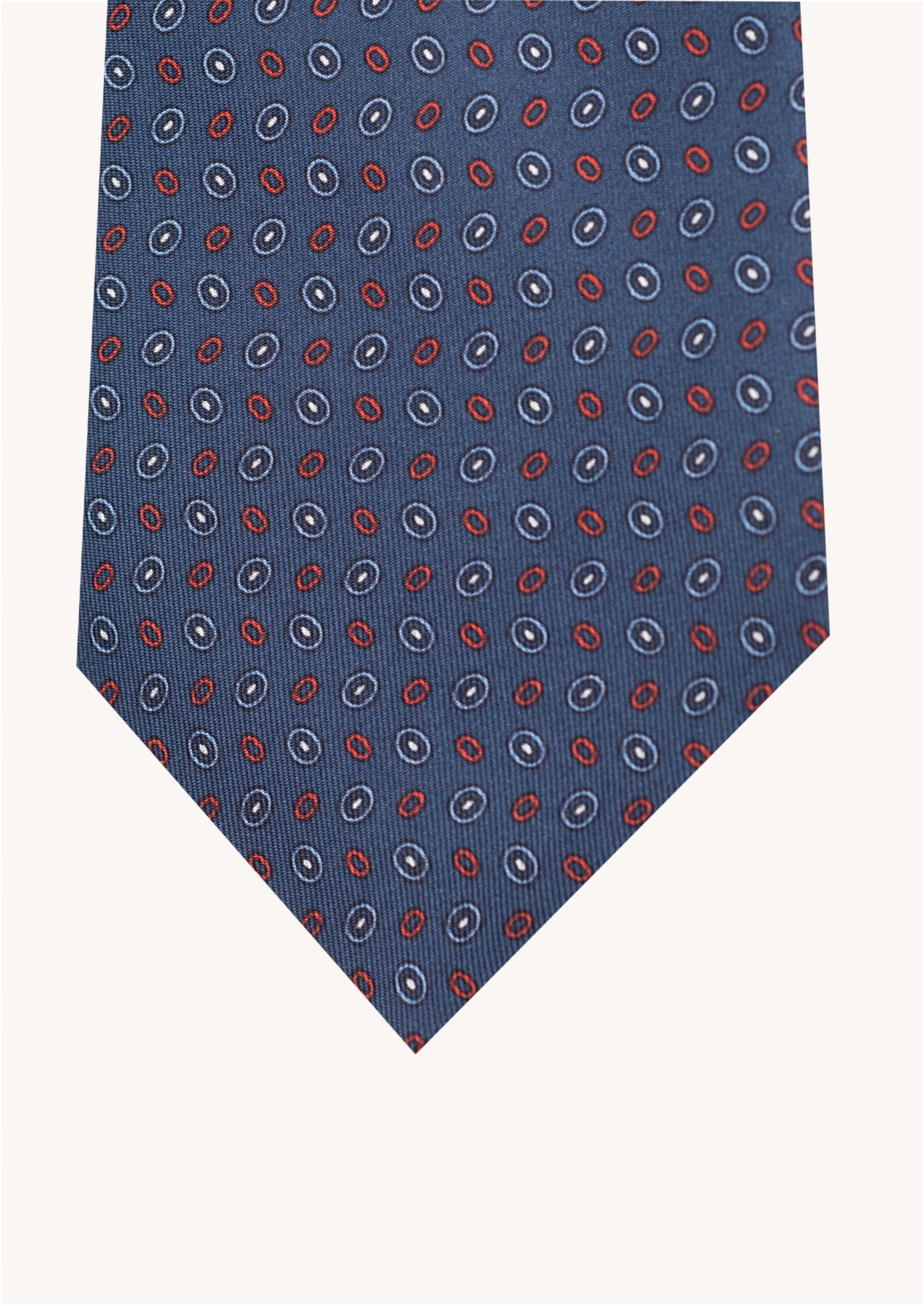 Cravate en twill 100% soie, ornée d'un motif ovale rouge et blanc sur fond bleu